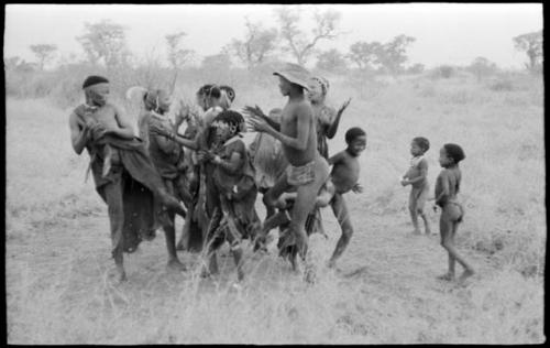 Women, children, and "Lame ≠Gao" playing a game