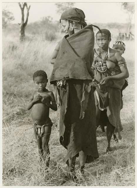 [No folder title]: Women from a visiting group and a girl (Bo's daughter) (print is a cropped image)