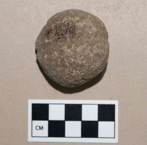 Small round, grooved, pecked stone club head or sinker