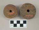 Terra cotta spindle whorls ornamented with incised lines