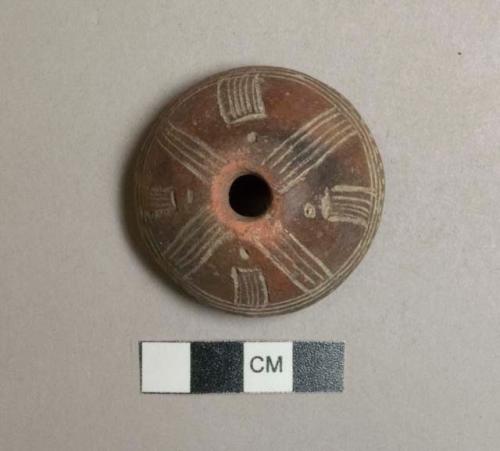 Ceramic spindle whorl, circular, incised decoration