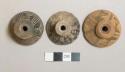 Ceramic spindle whorls, round, incised decoration