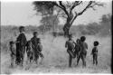 Girls and other children standing in groups