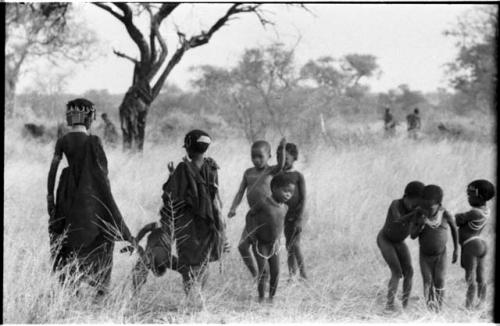 Group of girls and other children dancing