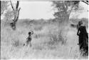 Boy running across the veld