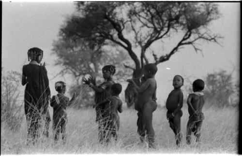 Boys dancing and girls clapping