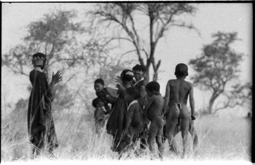 Boys dancing and girls clapping