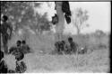 Groups of children sitting in the grass