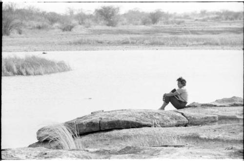 Elizabeth Marshall Thomas sitting beside the water