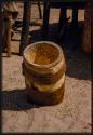 Stamping bowl in the village of Sechekele, wrapped with hide