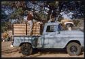 Lorna Marshall standing on a truck, with Foppe Hoogheimstra behind her