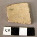 Pottery rim fragment - cream slipped