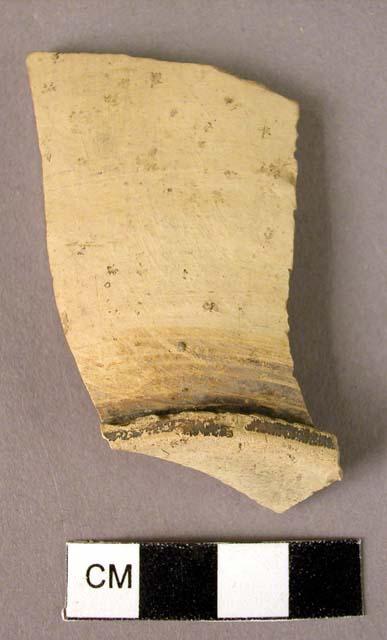 Glazed pottery rim on base fragment