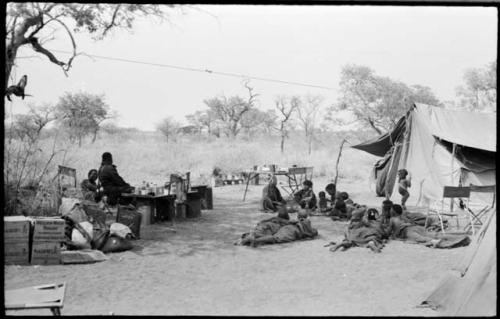 People lying in front of one of the expedition's tents