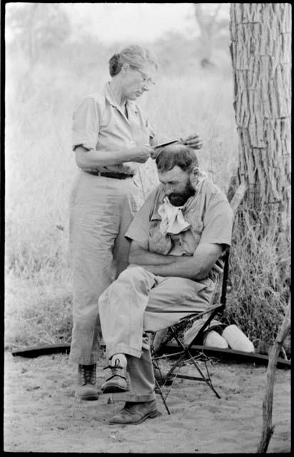 Lorna Marshall cutting Robert Story's hair