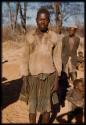 Man standing, showing his apron