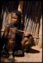 Woman holding a musical bow