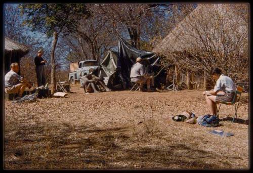 People sitting in front of a tarp, being recorded by Nicholas England, with Foppe Hoogheimstra and Deborah Marshall nearby