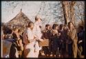 Group of people standing next to Nicholas England at a dance