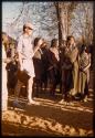 Group of people standing next to Nicholas England at a dance