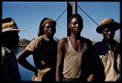 Men standing next to the pont (ferry) at Bagani