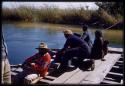 Manuel and other expedition members pulling cable on pont (ferry) at Bagani