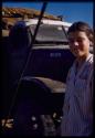 Deborah Marshall standing in front of the expedition truck on the pont (ferry) at Bagani