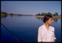 Deborah Marshall standing on the pont (ferry) at Bagani, profile