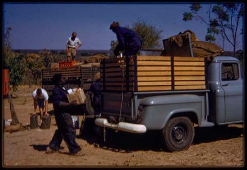 Expedition members loading trucks