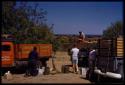 Expedition members loading trucks