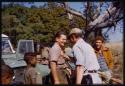 Father Jean Marie Molier standing with Nicholas England