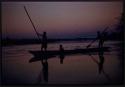 People poling a mokoro (makoro) boat on the Cuito River