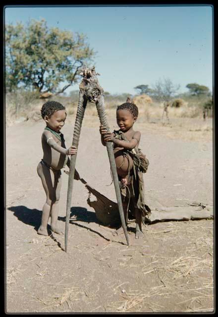 Children, Toys: "Little ≠Gao" and Be (daughter of Bo and Bau) playing with gemsbok horns