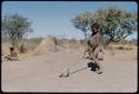 Children, Toys: /Gaishay (son of ≠Toma) pushing a tortoise shell like a toy car