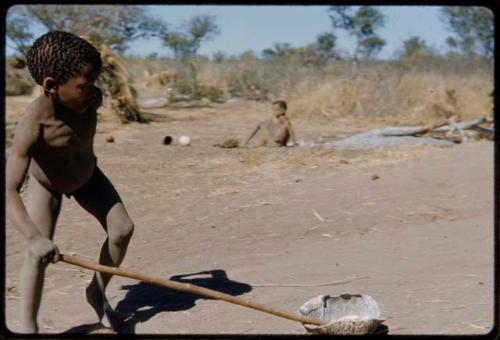 Children, Toys: /Gaishay (son of ≠Toma) pushing a tortoise shell like a toy car