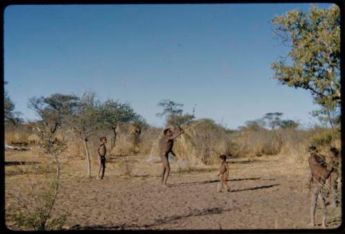 Children, Toys: Boys playing the djani (helicopter toy) game