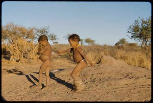 Children, Dancing: Two little boys dancing on an anthill