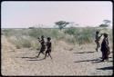 Children, Groups, play: Girls playing Tamah n!o’an (the ball game) with a green melon