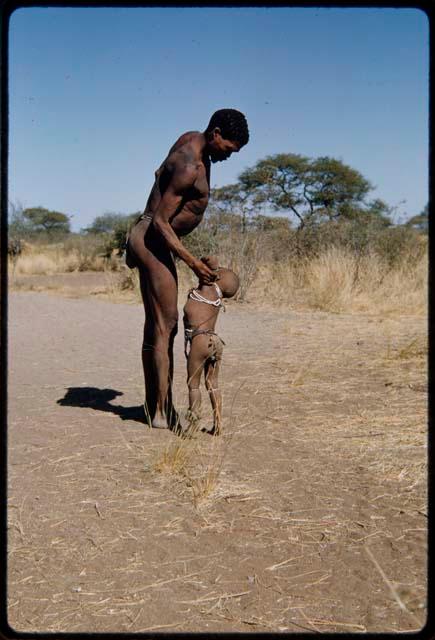 Children, Fathers and sons: "Gao Medicine" starting to lift his son, /Gaishay, to his shoulder