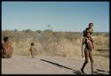 Children, Fathers and sons: Boy carrying /Gaishay across a termite mound