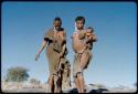 Dance: !U carrying !Ungka Norna, dancing with //Kushay and !Ungka near a waterhole