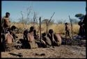 Fire, "Old ≠Toma's": People sitting near the remains of "Old ≠Toma's" skerm, burned to the ground