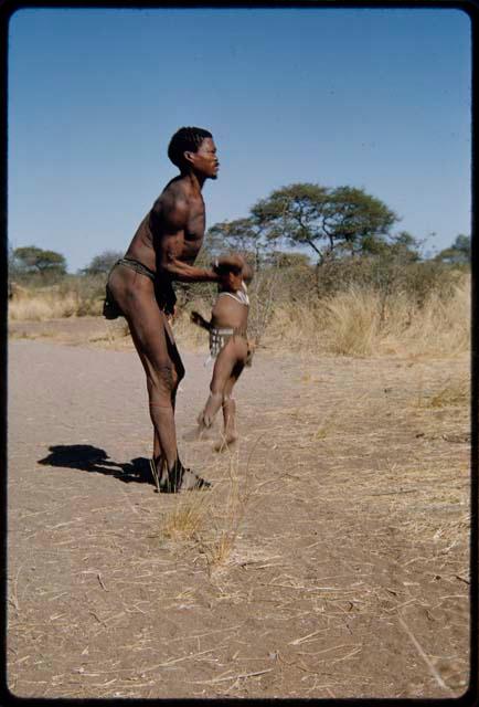 Children, Fathers and sons: "Gao Medicine" lifting his son, /Gaishay, to put him on his shoulder