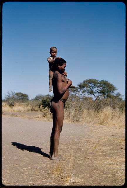 Children, Fathers and sons: "Gao Medicine" holding his son, /Gaishay, on his shoulder