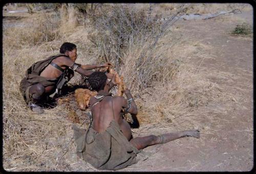 Food, Meat: Two women preparing an animal stomach