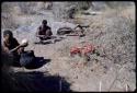 Food, Meat: "Old ≠Toma" emptying an ostrich egg into an Ovambo pot, with another man sitting beside him and a piece of meat on the ground near them