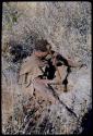 Food Gathering, General: Woman digging with her digging stick