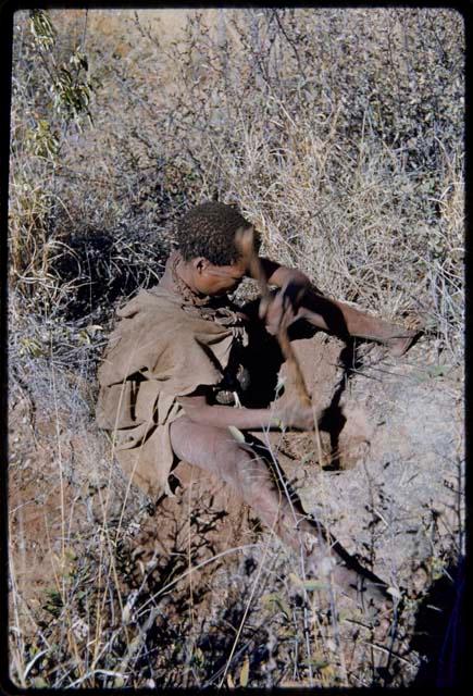 Food Gathering, General: Woman digging with her digging stick