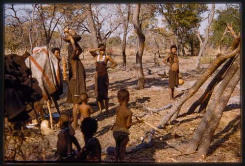 Women and children setting out to get water