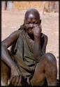 Elderly Mbukushu woman sitting 
